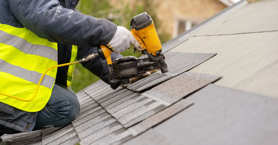 A person repairing a rood