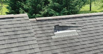 A roof with damaged tiles